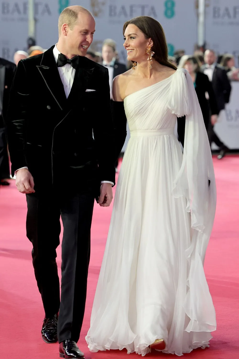 Kate in lilac floor length dress with Will in black suit 