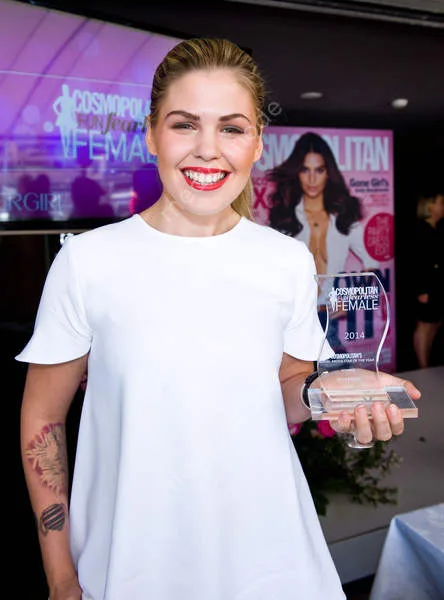 Belle Gibson receiving an award