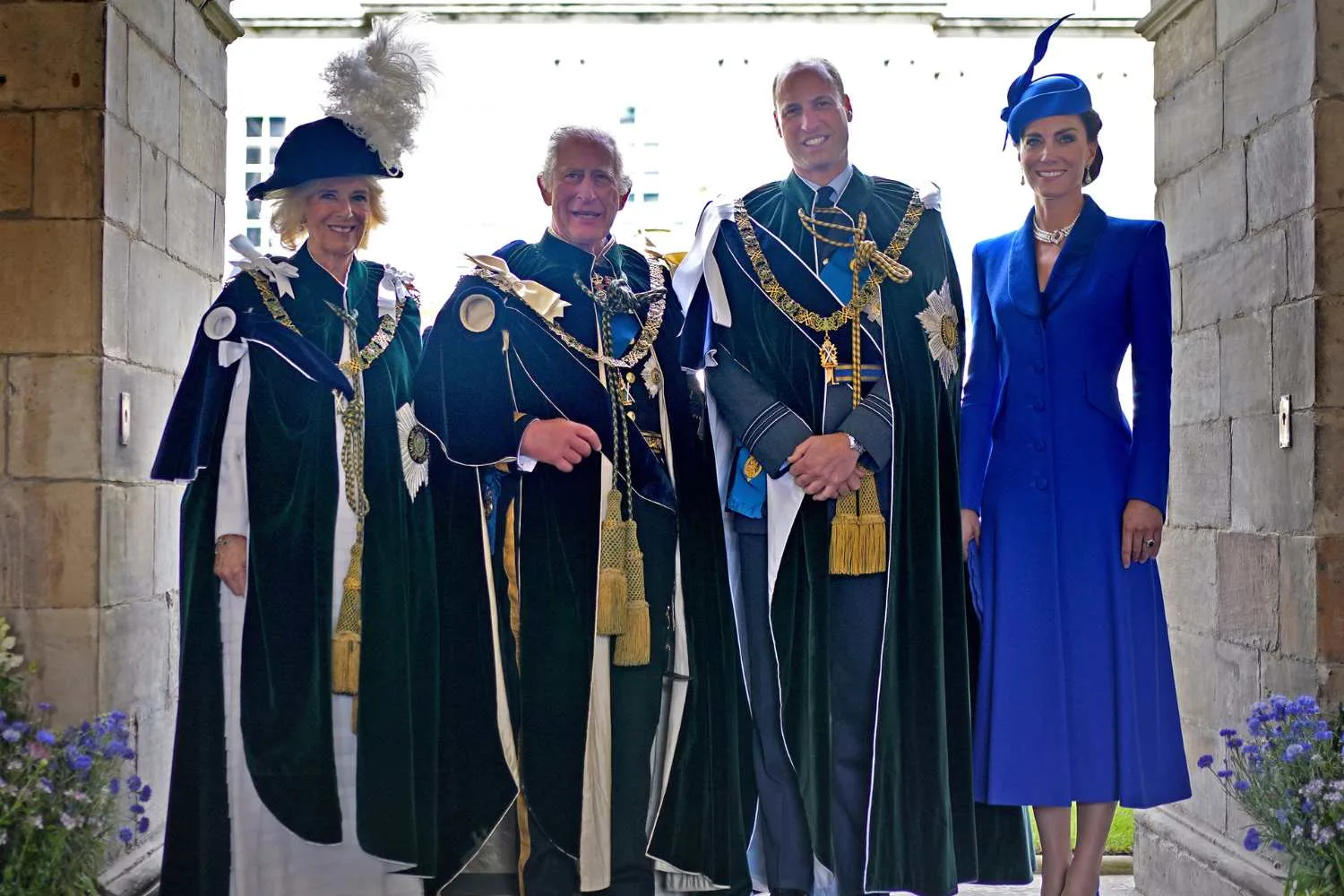 Kate Middleton in blue dress and headpiece with Prince Will in royal wear, King Charles and Queen Camilla 