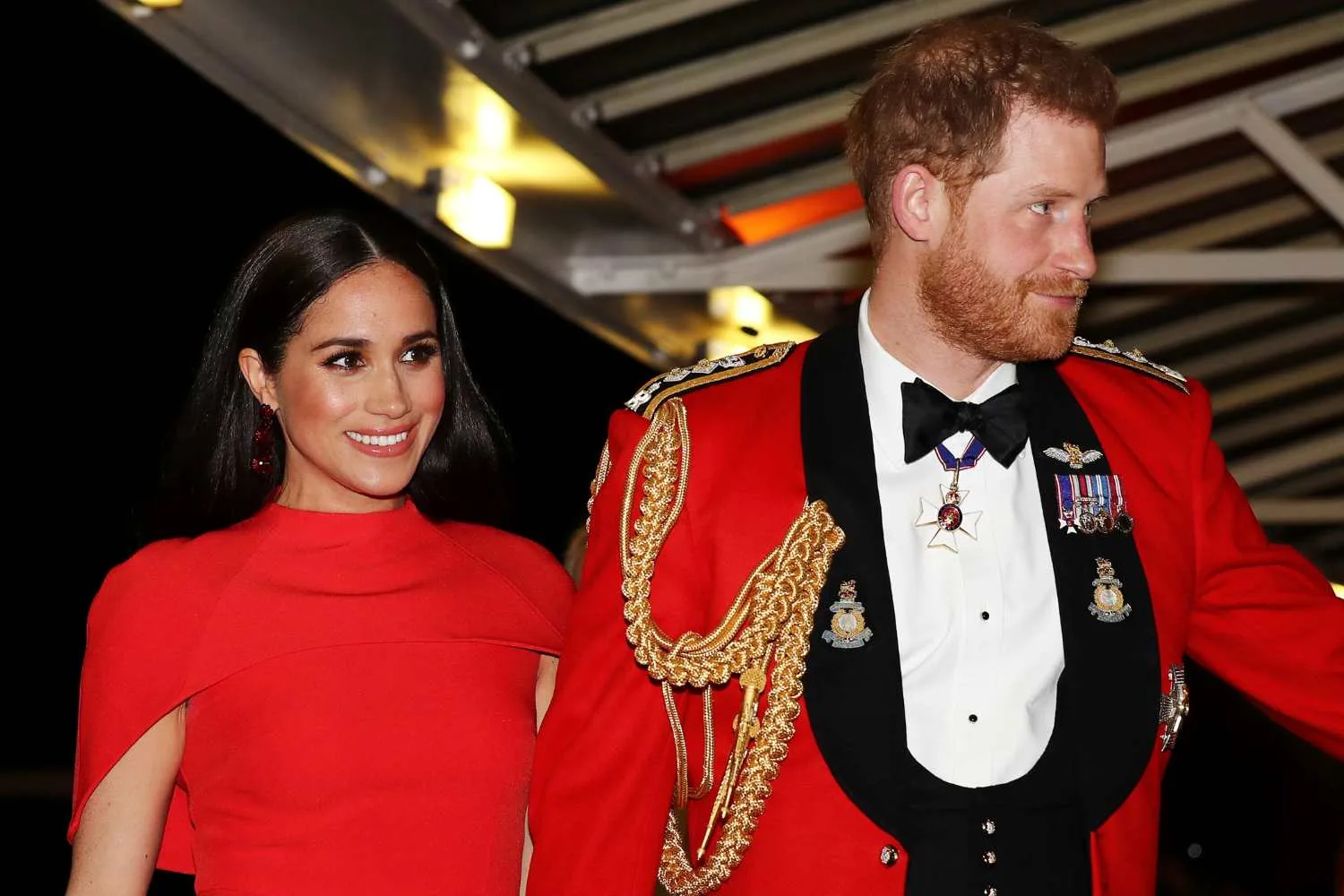 Harry and Meghan both in red