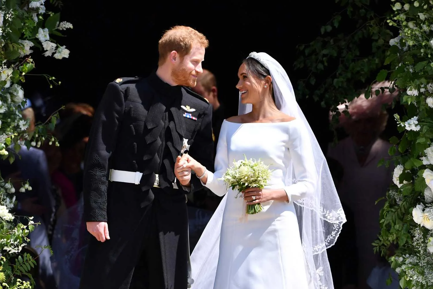 Harry in suit and Meghan in wedding dress 