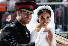 Harry and Meghan in a suit and wedding dress on their wedding day