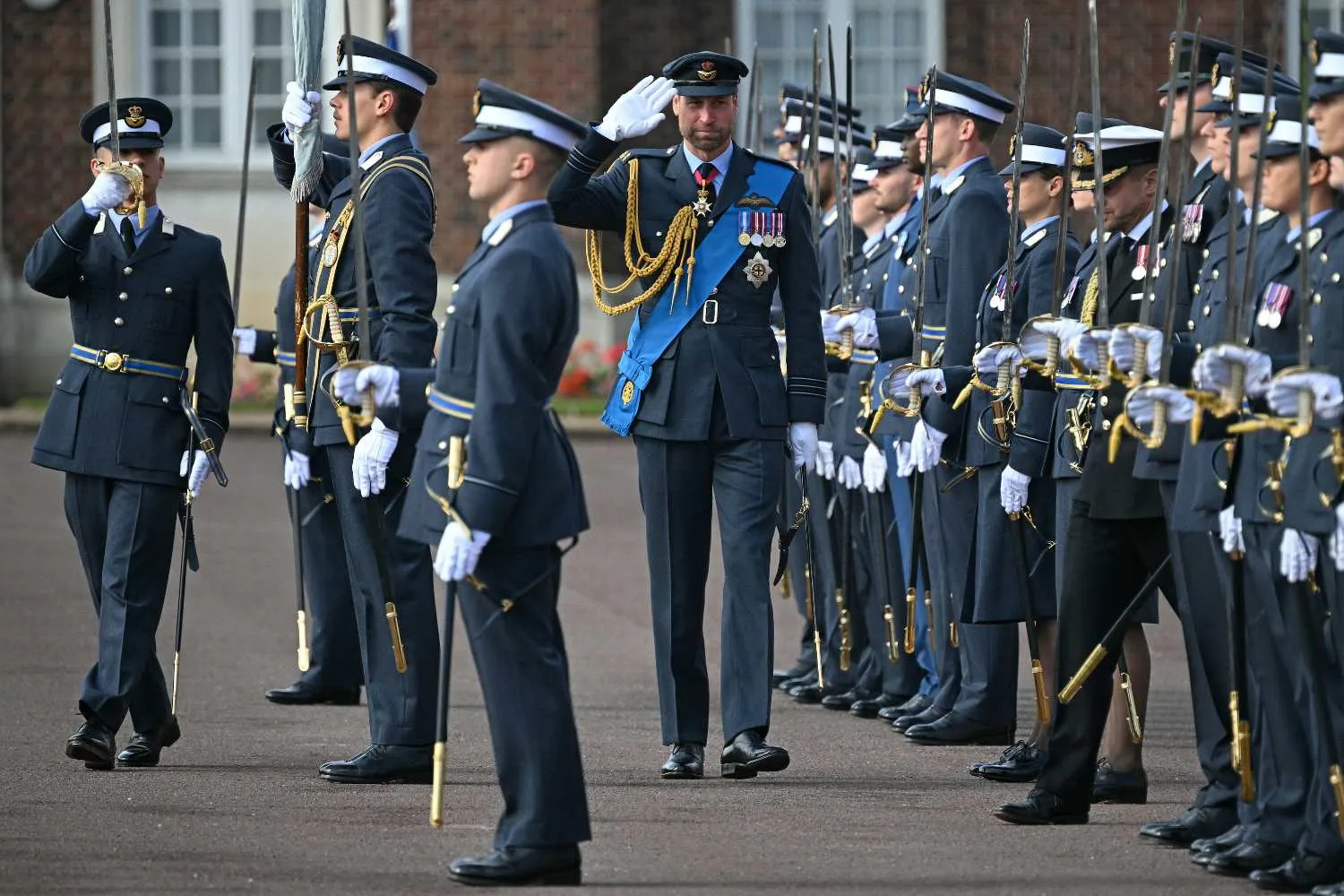 Prince William in military uniform saluting