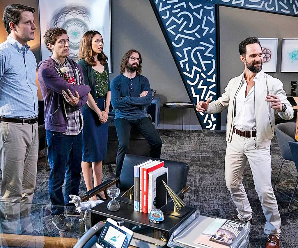 Chris Diamantopoulos standing with other cast members of Silicon Valley on the set of the show.