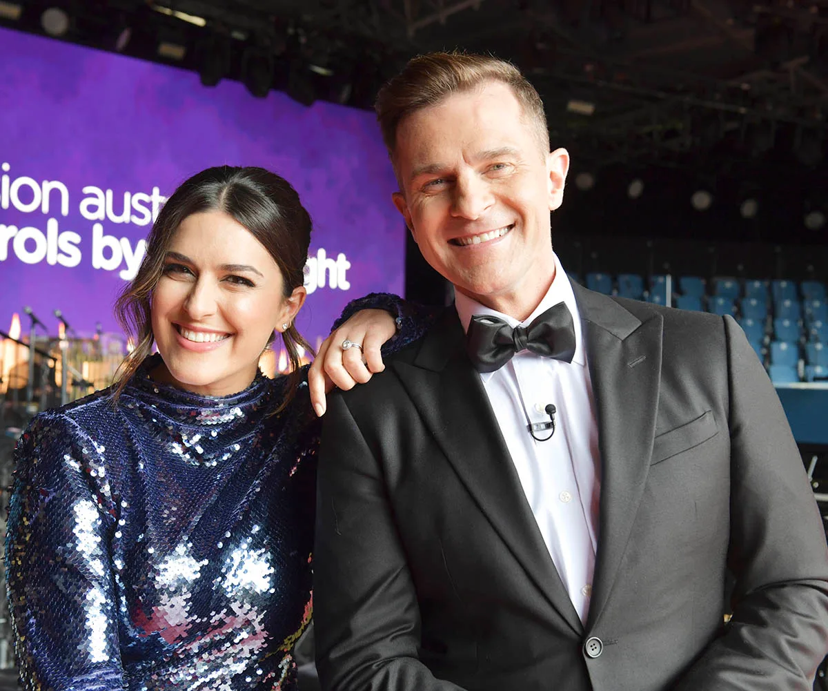 Carols By Candlelight co-hosts Sarah Abo and David Campbell.