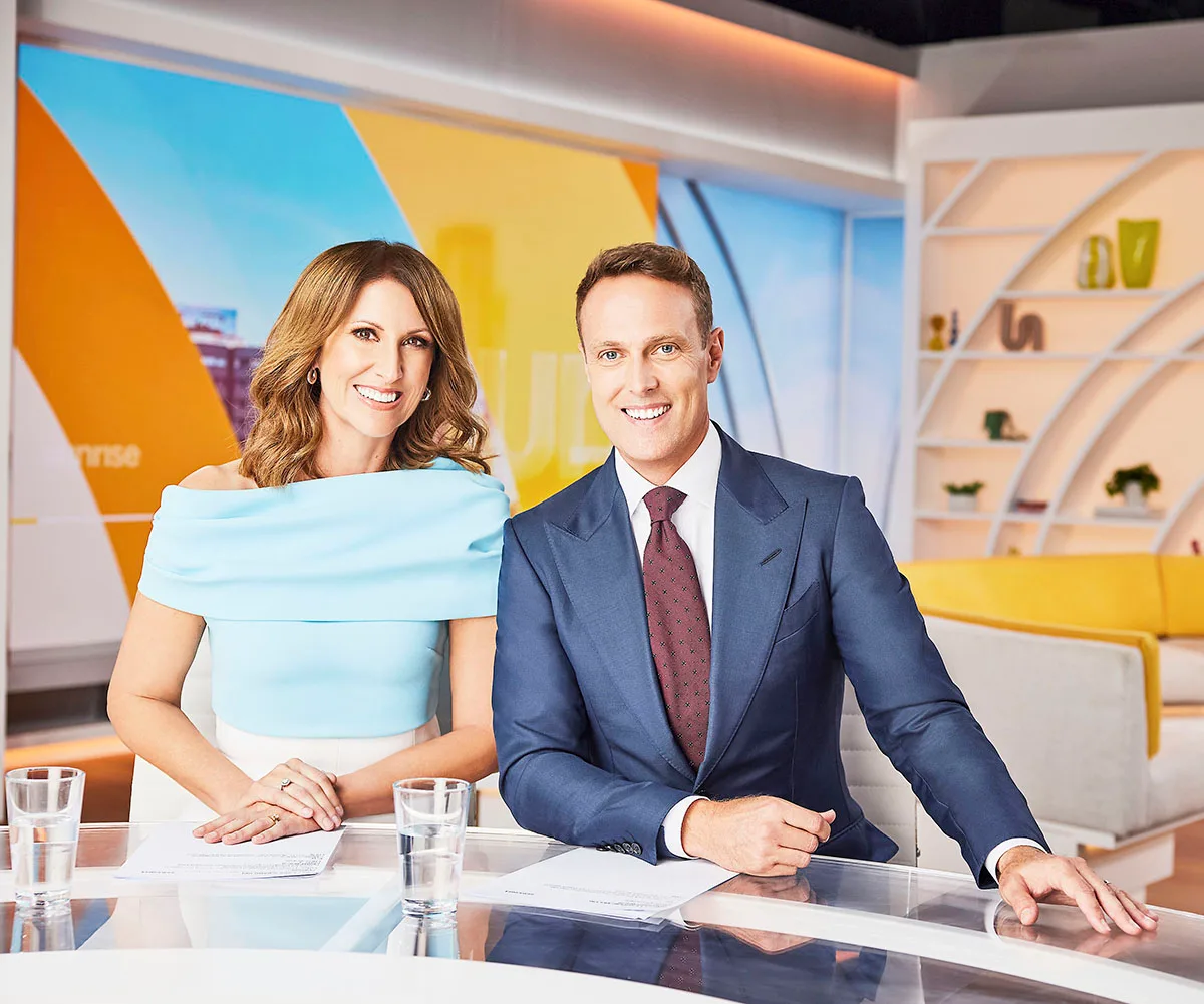 Natalie Barr and Matt Shirvington sit next to each other on the set of Sunrise.