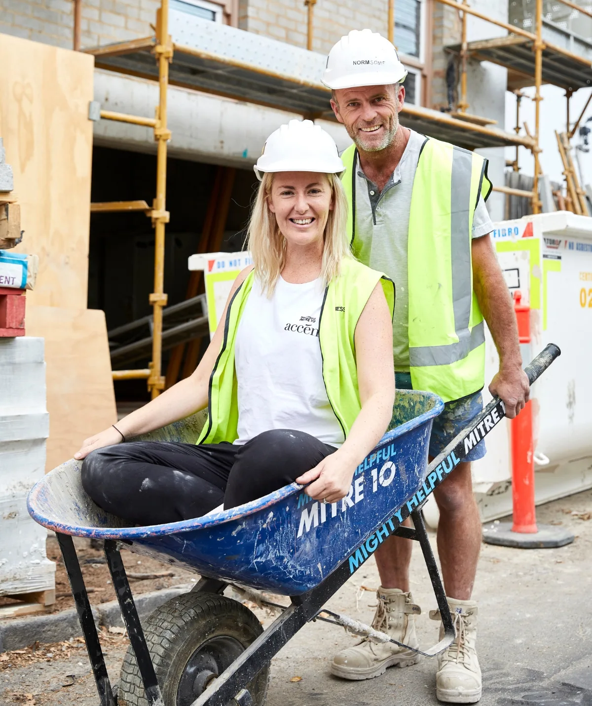 Jess Eva and Norm Hogan with a wheelbarrow on The Block.