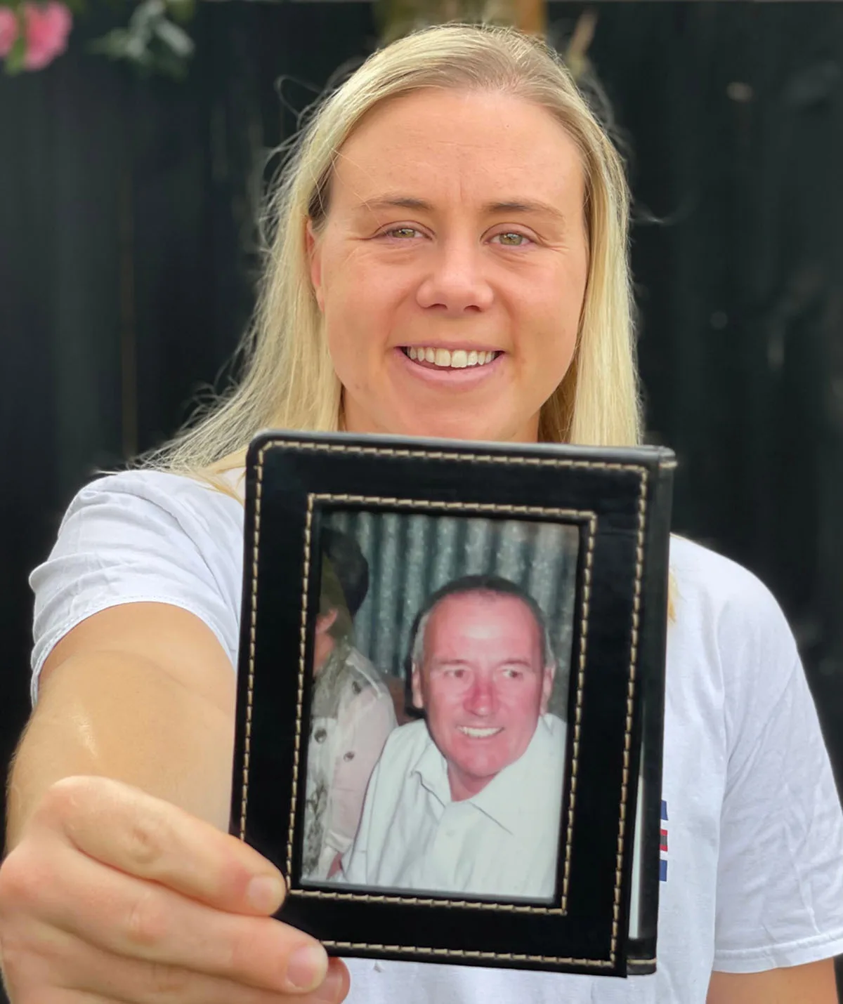 Sarah Robb with a photo of her dad. (Image: Supplied)