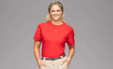 Shayna Jack in her I'm a Celebrity... Get Me Out of Here! promo shot. With an army print bandana on, red t-shirt and beige shorts.