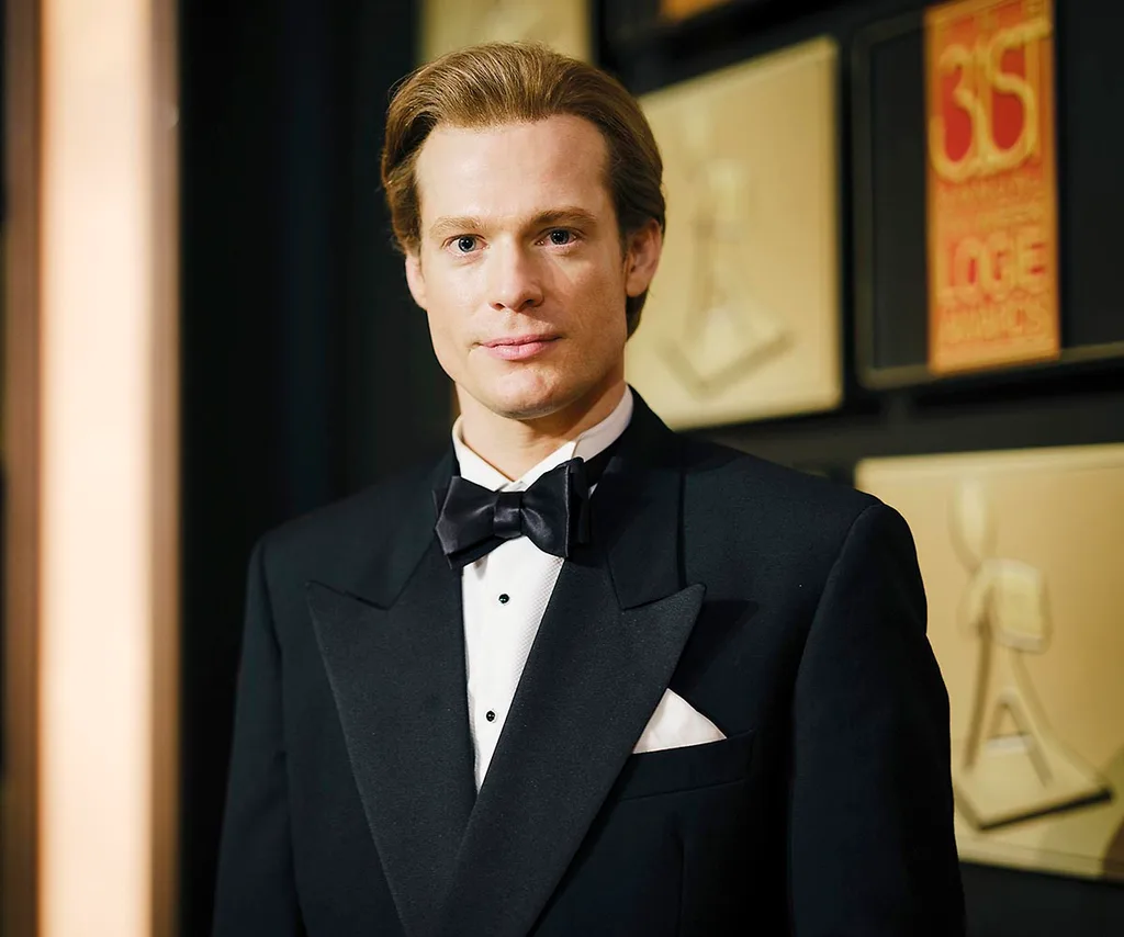 Sam Reid, as Dale Jennings, poses at the 1989 Logies in The Newsreader.