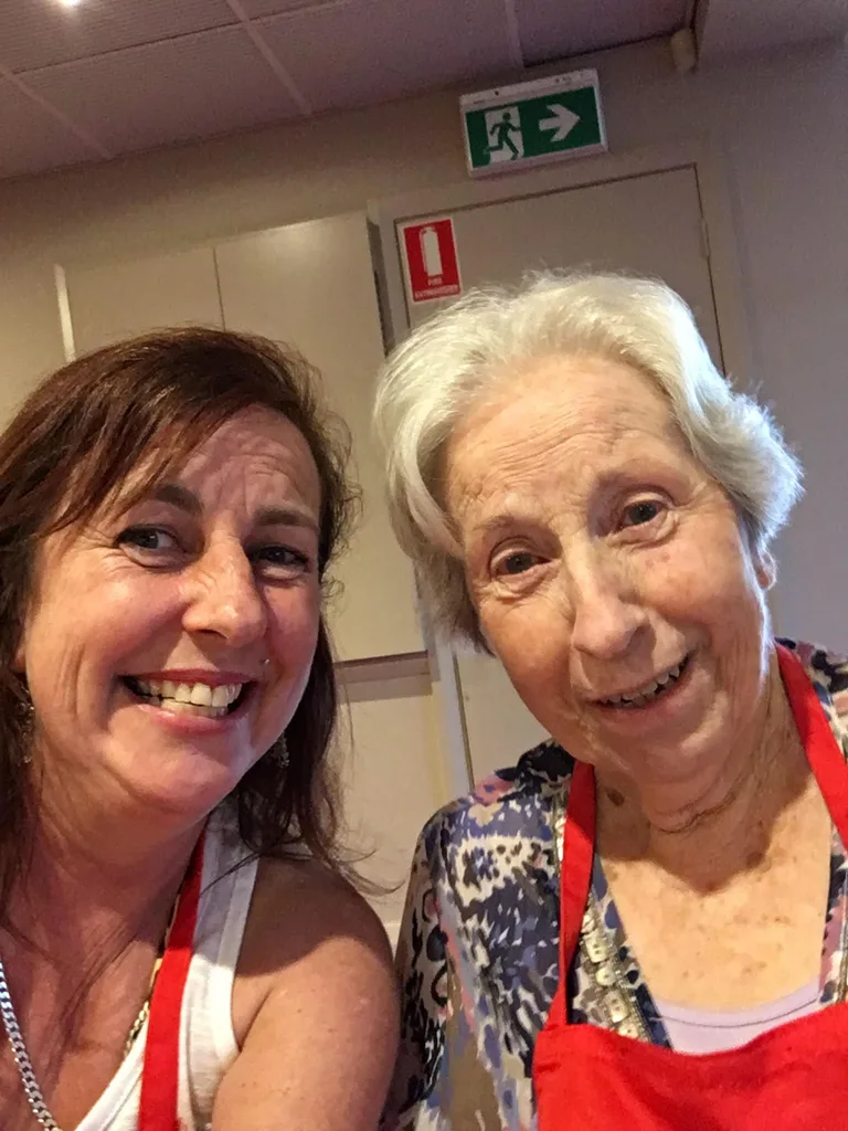 Terri and her elderly mother Joan smiling at the camera
