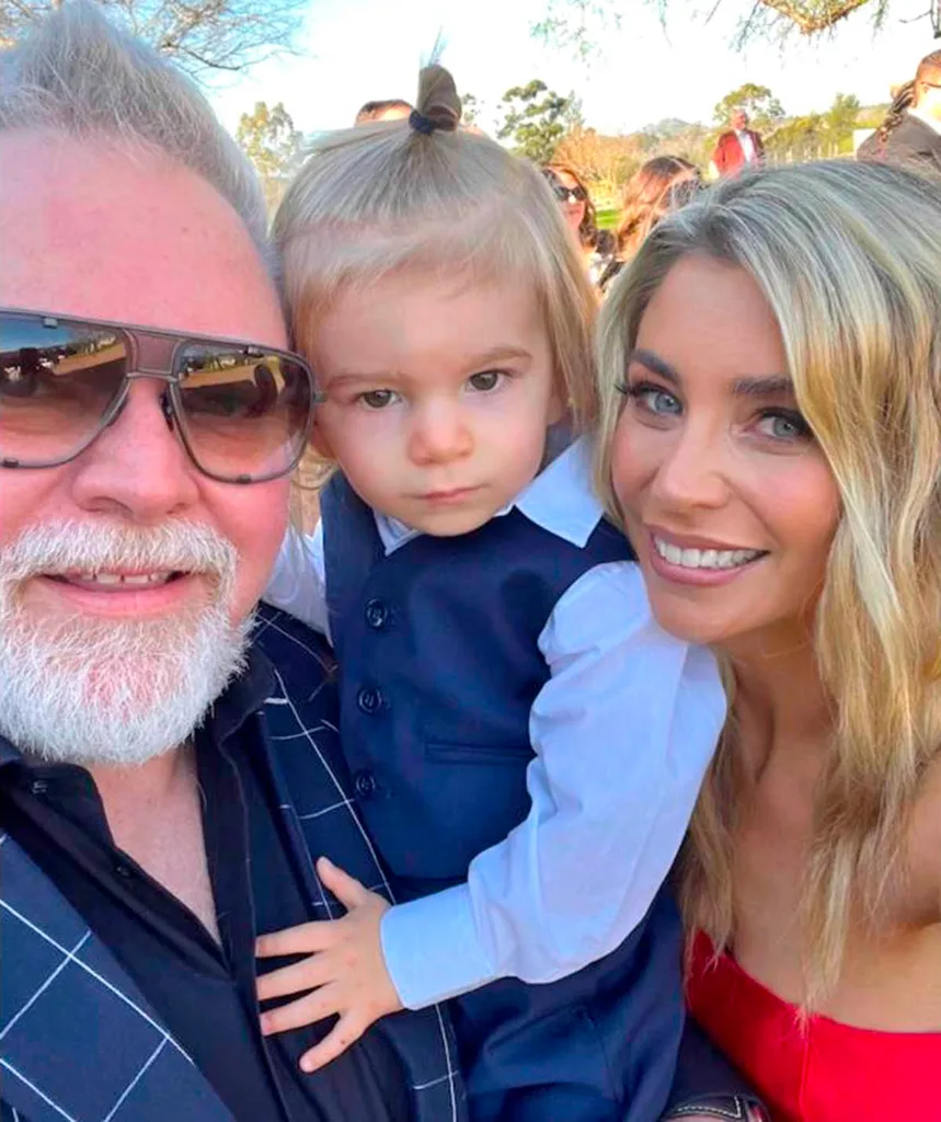 Kyle Sandilands (left) holds his baby boy Otto (middle)