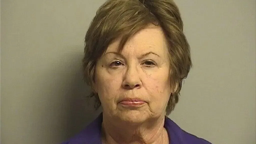 Mugshot of Judith Nix with short brown hair in blue collared shirt