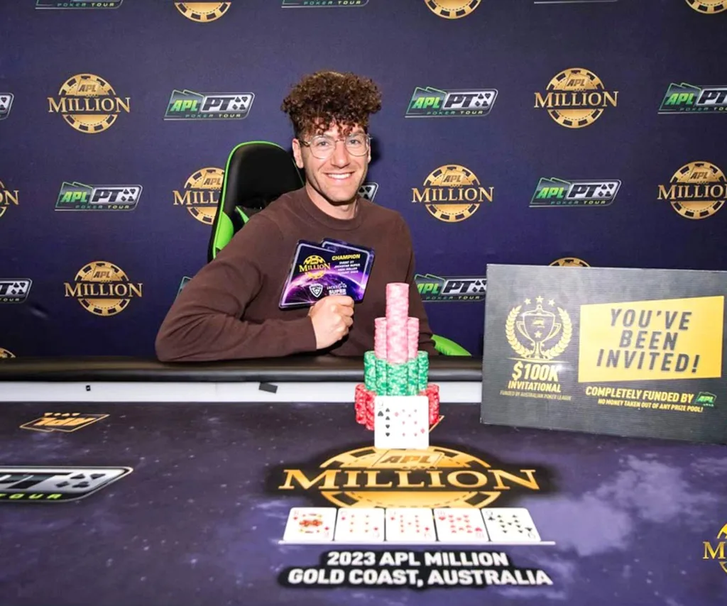 AJ sits at a poker table.