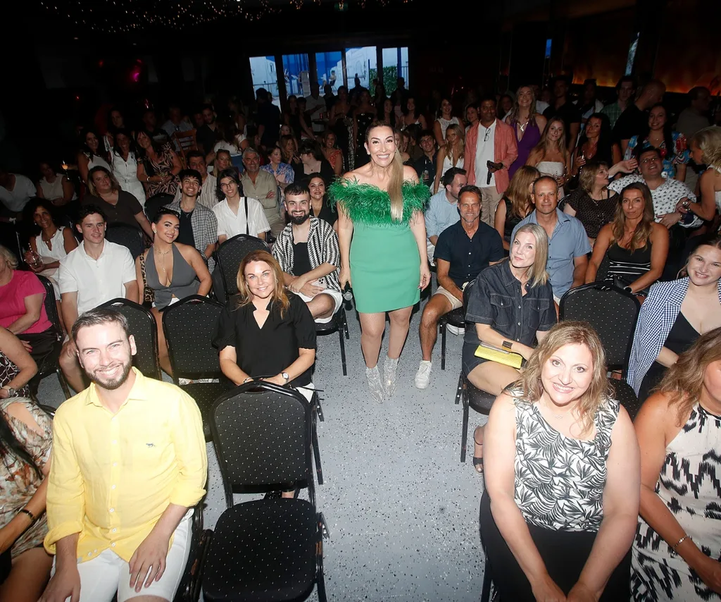 Morena stands amongst a crowd of friends and family at her viewing party.