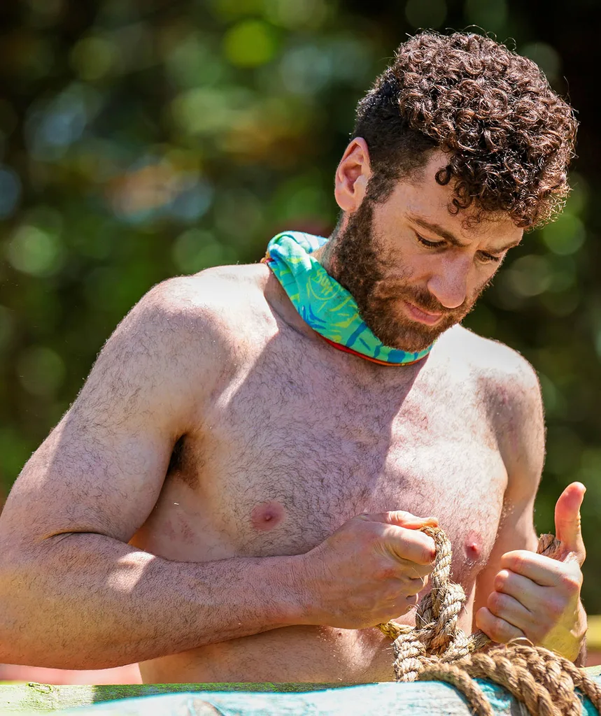 AJ, shirtless, on Australian Survivor.