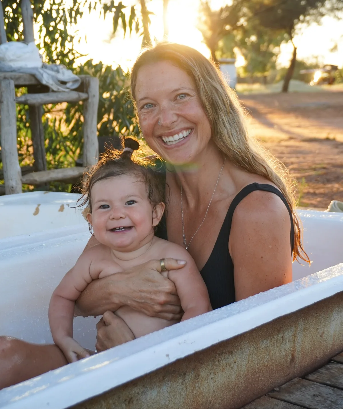 Maxine and baby Zena in a bath