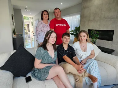 Family winners on couch their new home