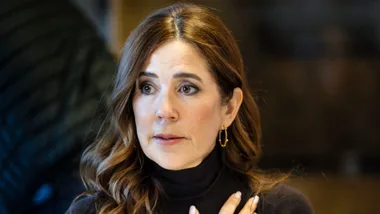A brunette woman is looking worried.