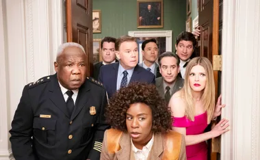 Uzo Aduba, as Cordelia Cupp, stands in front of other cast members, inside the White House, all looking alarmed.