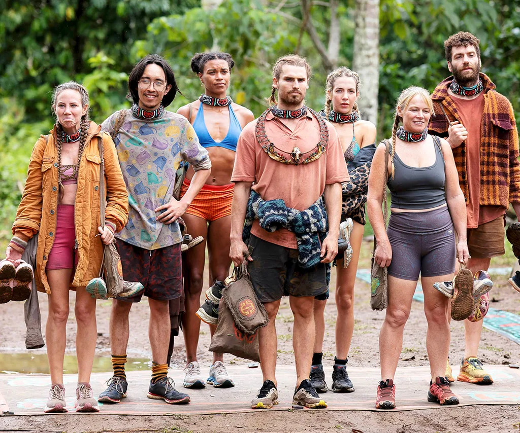 The final seven, with Kaelan in the centre wearing the immunity necklace, stand and wait to hear about the next immunity challenge