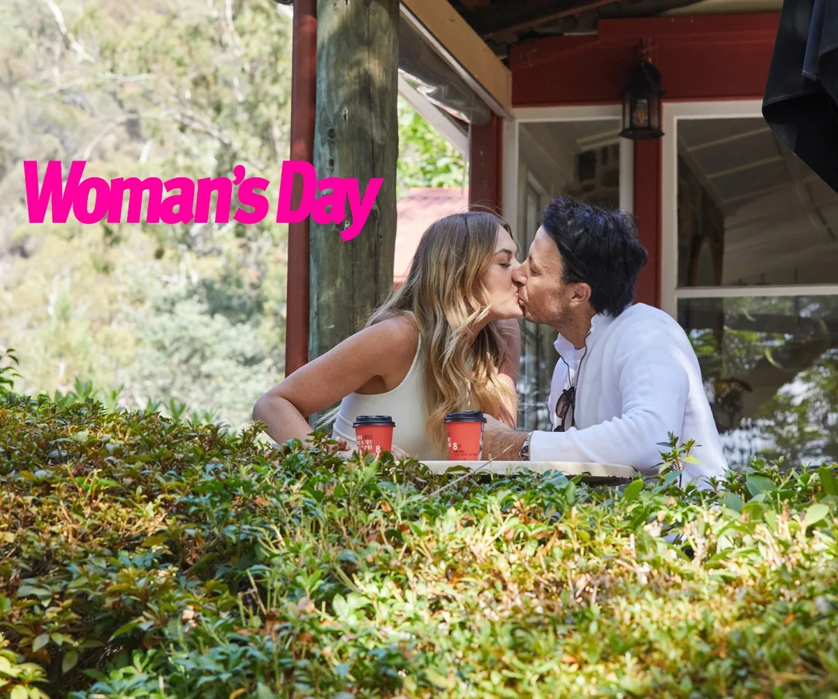 Jacqui and Clint share a kiss at the local coffee shop
