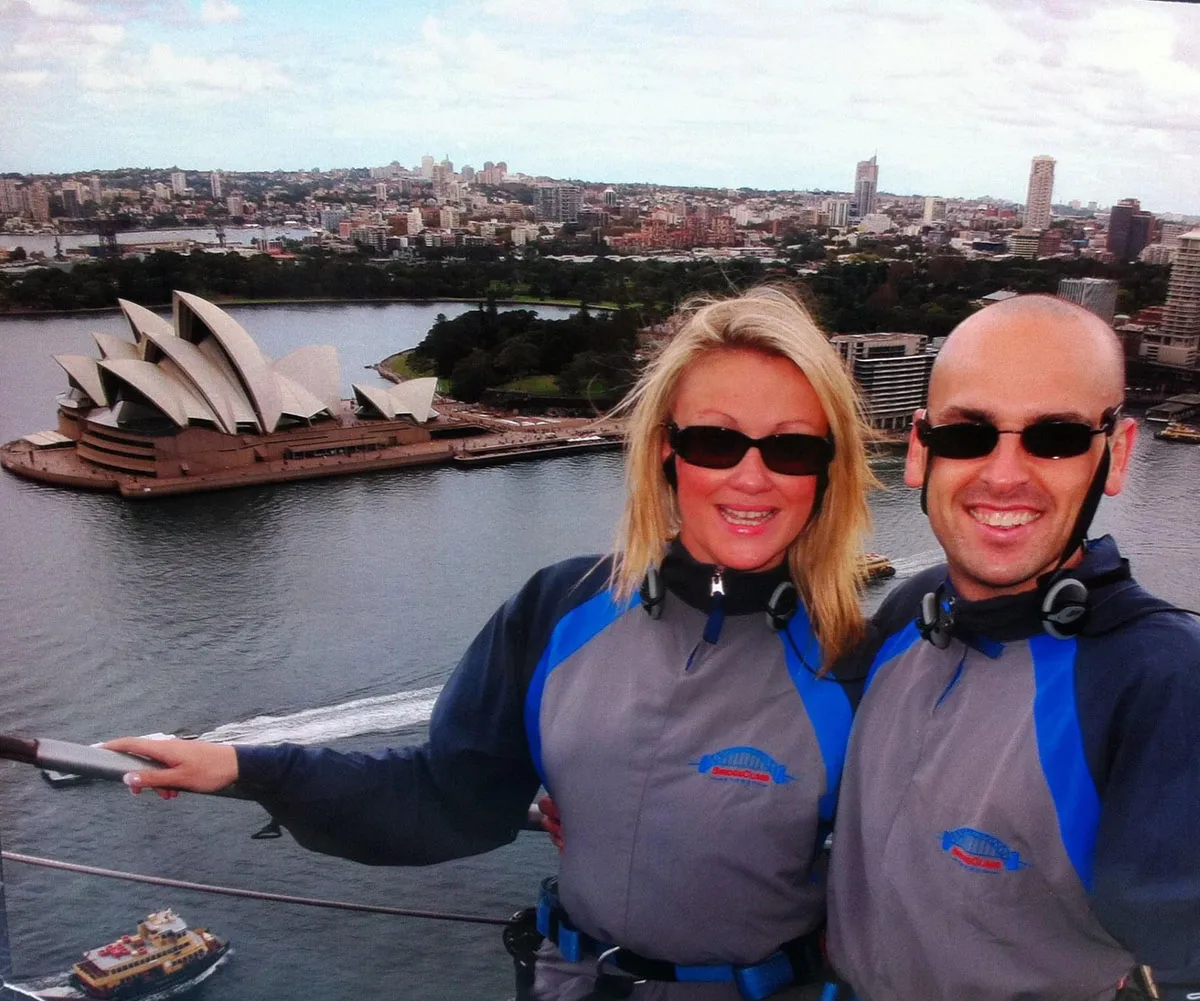 Me and my husband Paul Forsyth climbing Sydney Harbour bridge 2003 before my diagnosis. (Image: Supplied)