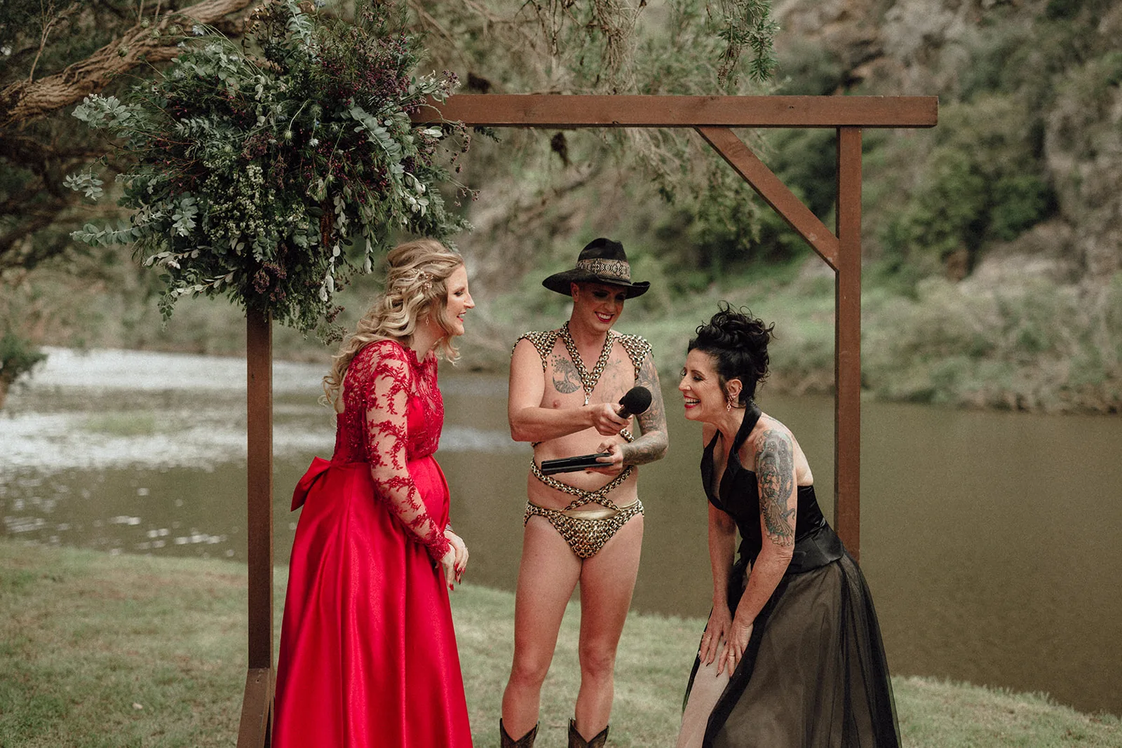 Monty Haron officiates a wedding in budgy smugglers