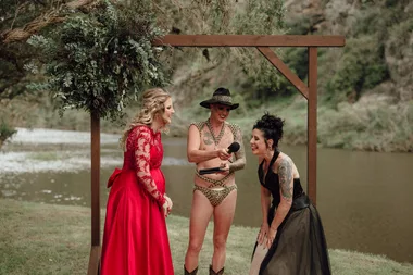 Monty Haron officiates a wedding in budgy smugglers