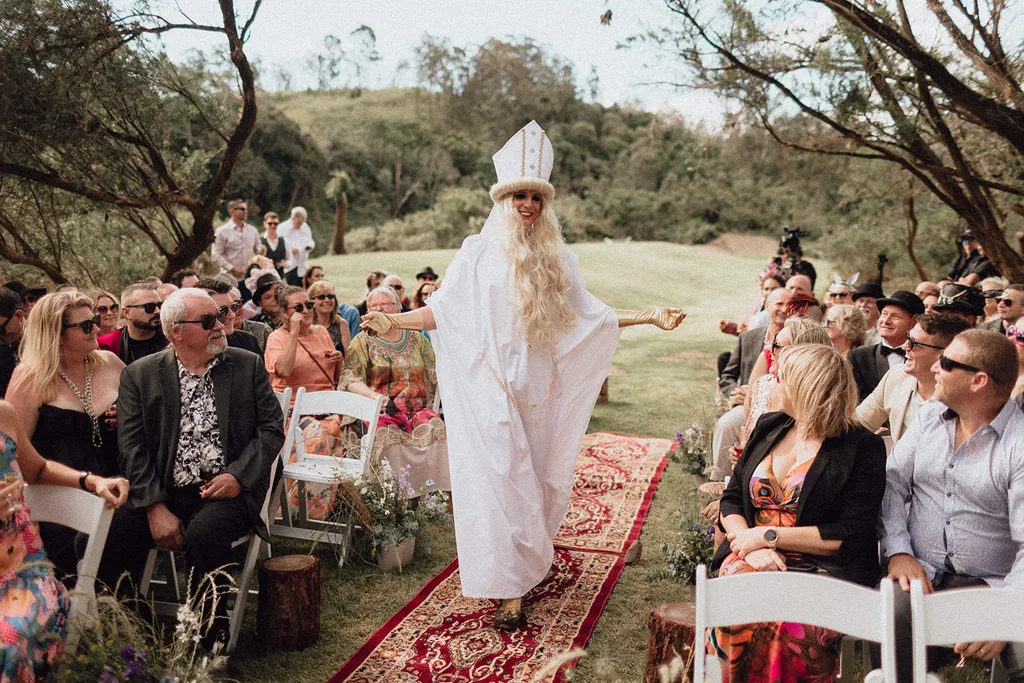 Monty officiates Harriet and Leo's wedding dressed as Moira from Schitts Creek