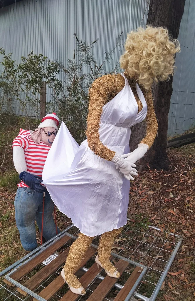 Scarecrow dressed as Where's Wally looking up Scarecrow Marilyn Monroe's dress