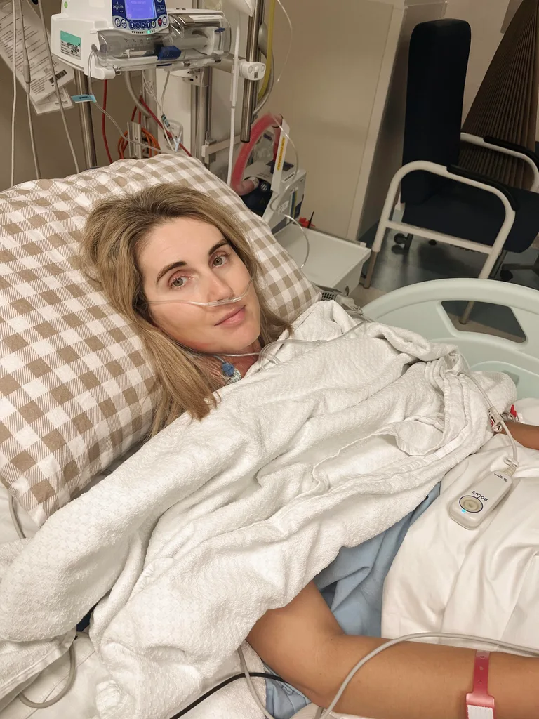 Rhiannon laying in an ICU hospital hours after surgery