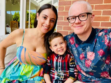 Jade and husband Daniel with son Jordan between them smiling at camera