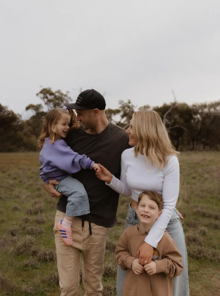 daughter Elke, husband Shannon, son Maverick and Rhiannon embracing in a field