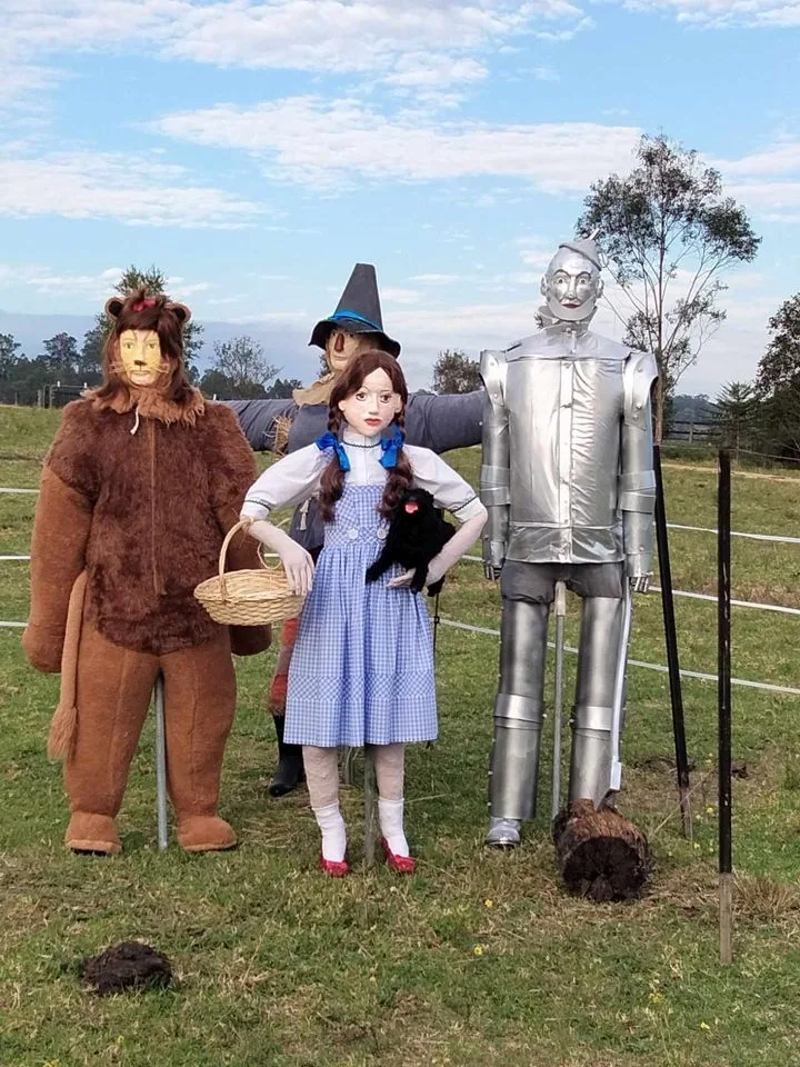 Scarecrows dressed as Lion, Scarecrow, Dorothy and Tinman from Wizard of Oz