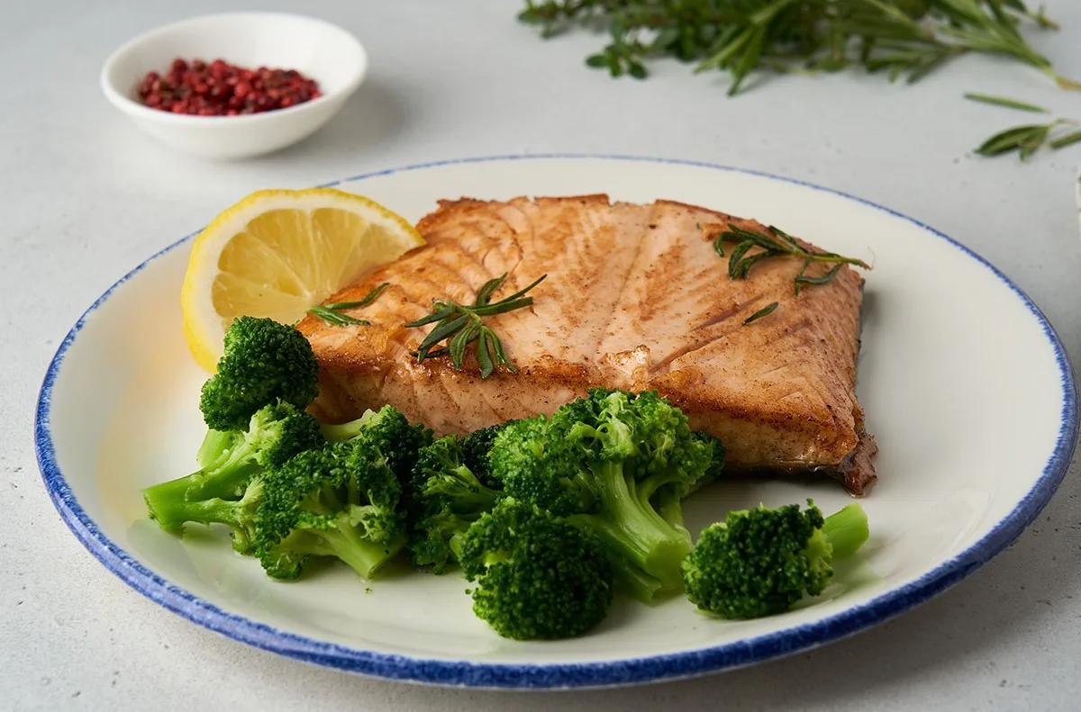 Salmon fillet and broccoli florets. (Image: Getty Images) 