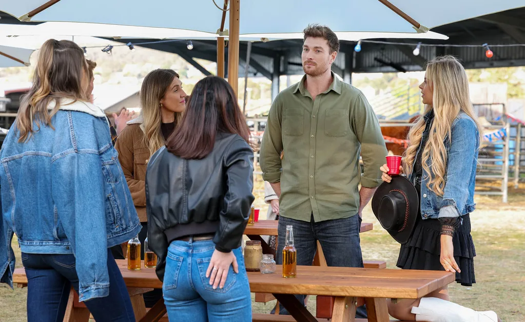 Farmer Thomas chats to his ladies at the Goulburn Rodeo.