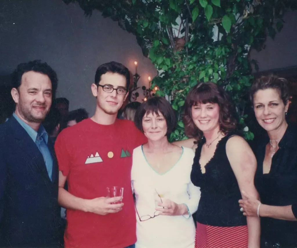Tom Hanks stands with son Colin, ex-wife Susan, daughter EA, and wife Rita Wilson in a retro image
