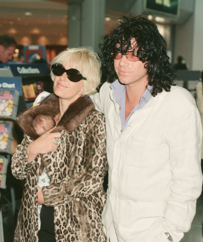 Michael Hutchence poses with his wife at the time Paula Yates
