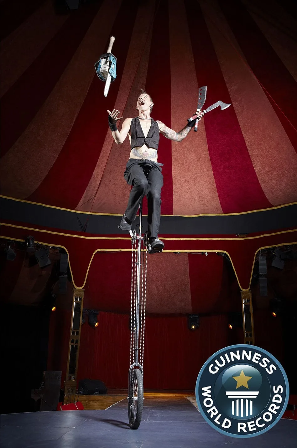 Me whilst chainsaw juggling on a tall unicycle. (Image: Guiness World Records)