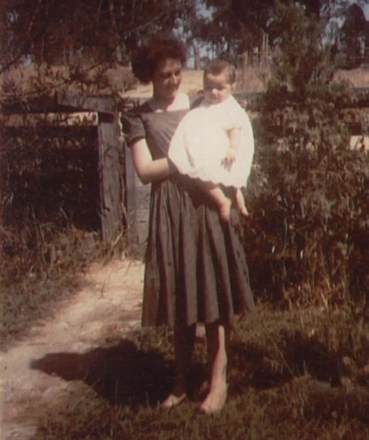 Me with my adoptive mother, Lois Mackieson, in the front garden, 1963. (Image: Supplied)