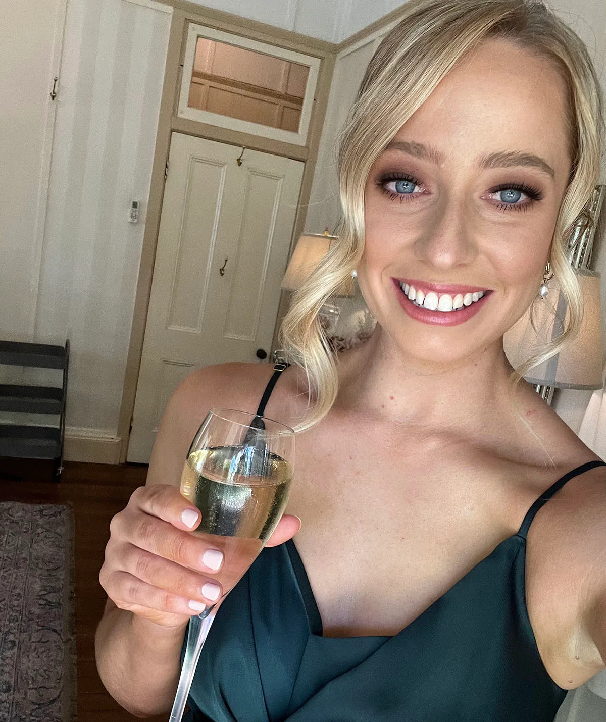 Me having champagne at the wedding shortly before finding the lump. (Image: Supplied)