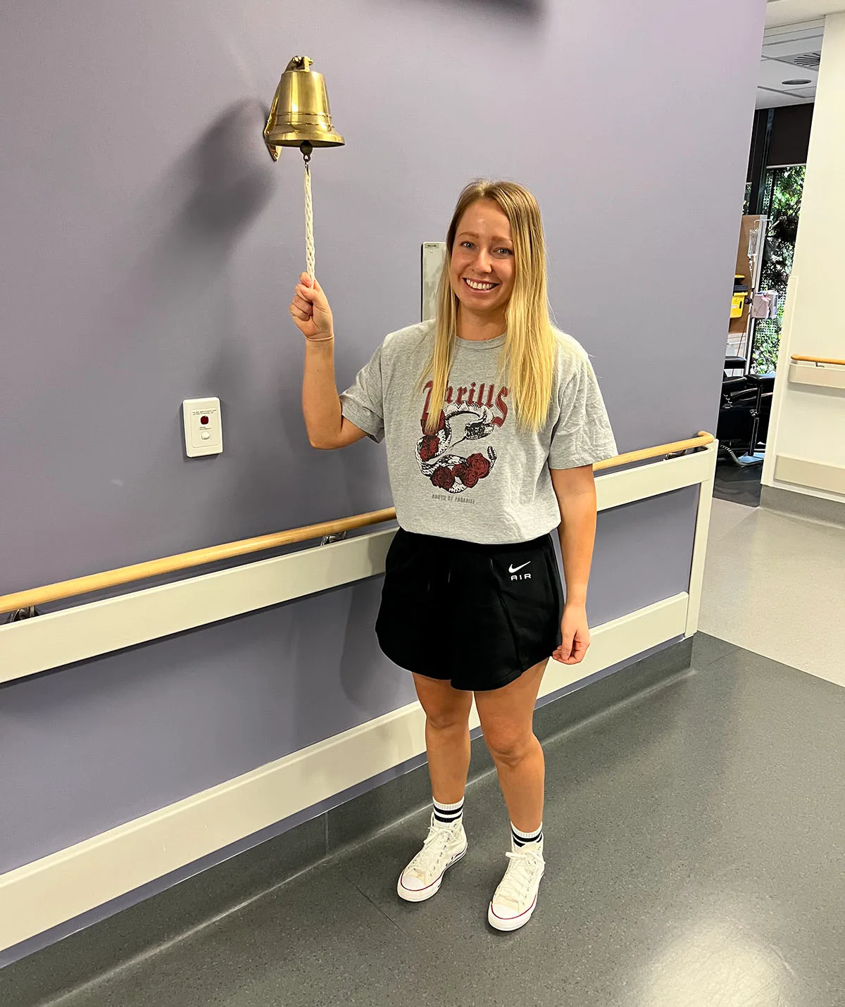 Me ringing the bell after finishing active treatment. (Image: Supplied)