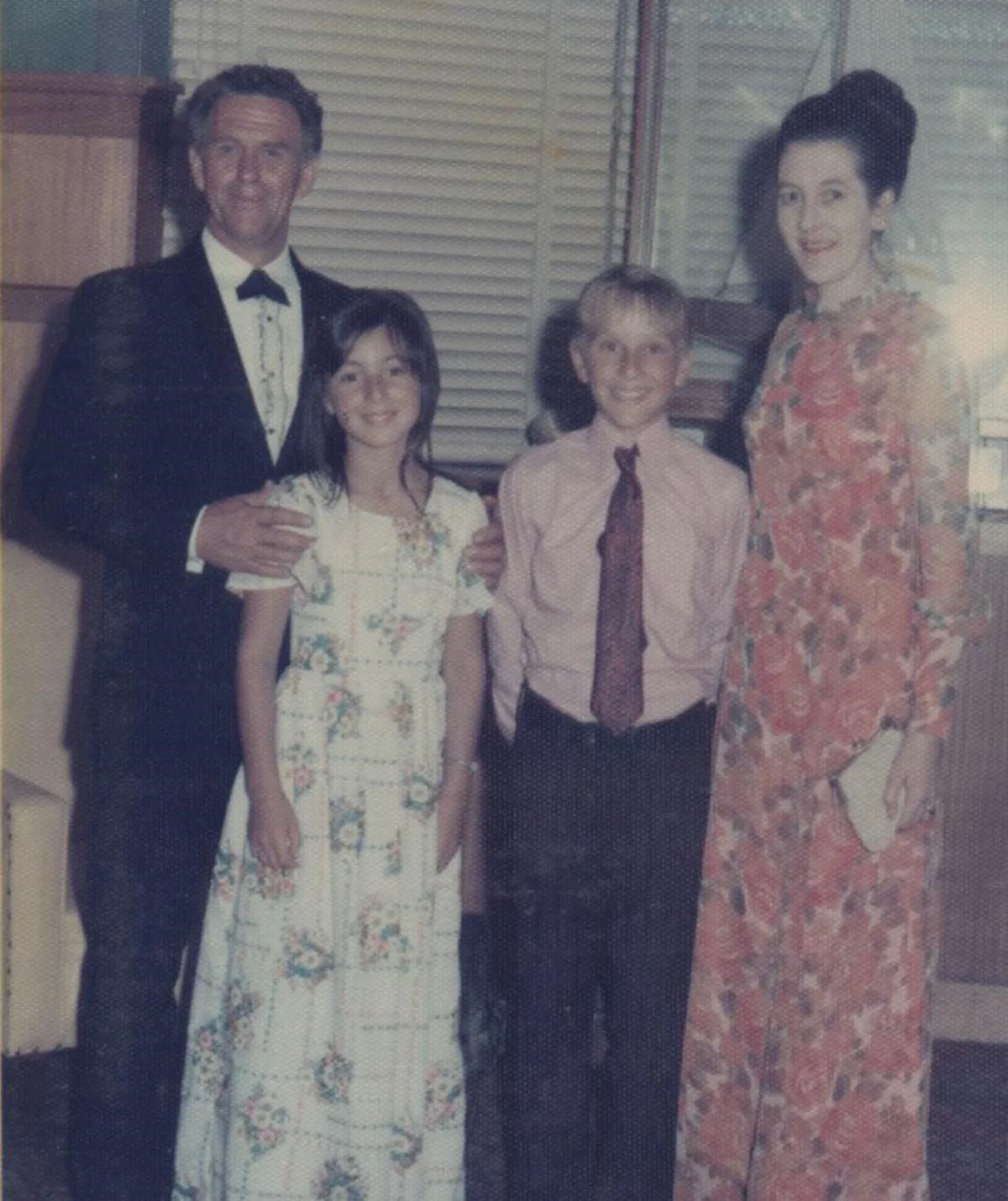 Me (junior bridesmaid) with my adoptive family at a wedding reception in Melbourne, 1973. (Image: Supplied)