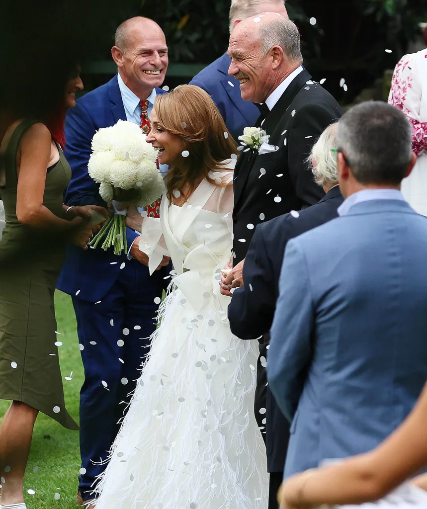 Wally and Lynda walk in the park after just exchanging vows.