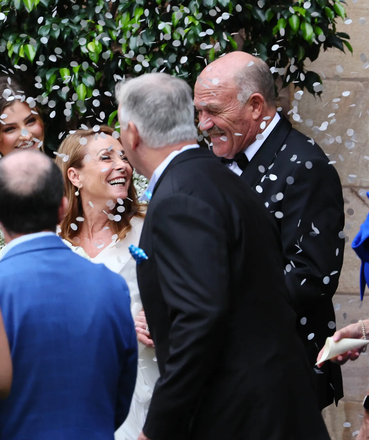 Lynda and Wally are seen walking out of the church.