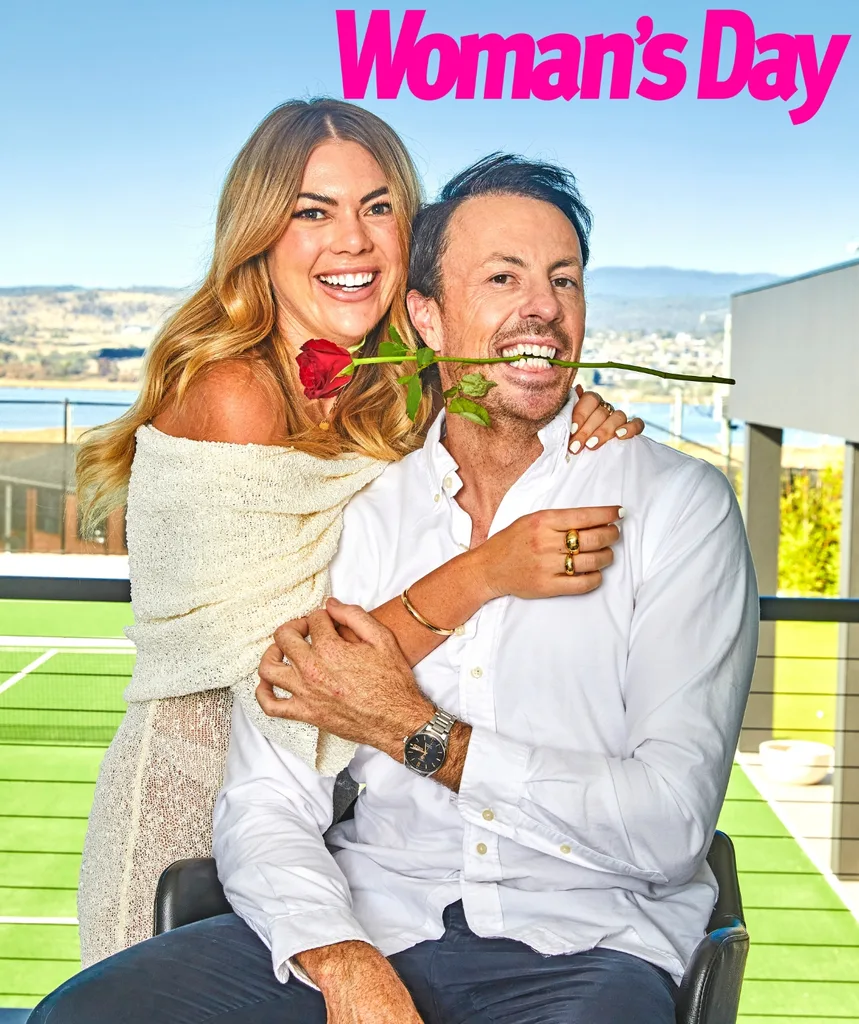 Jacqui poses with Clint who has a rose stem in his mouth