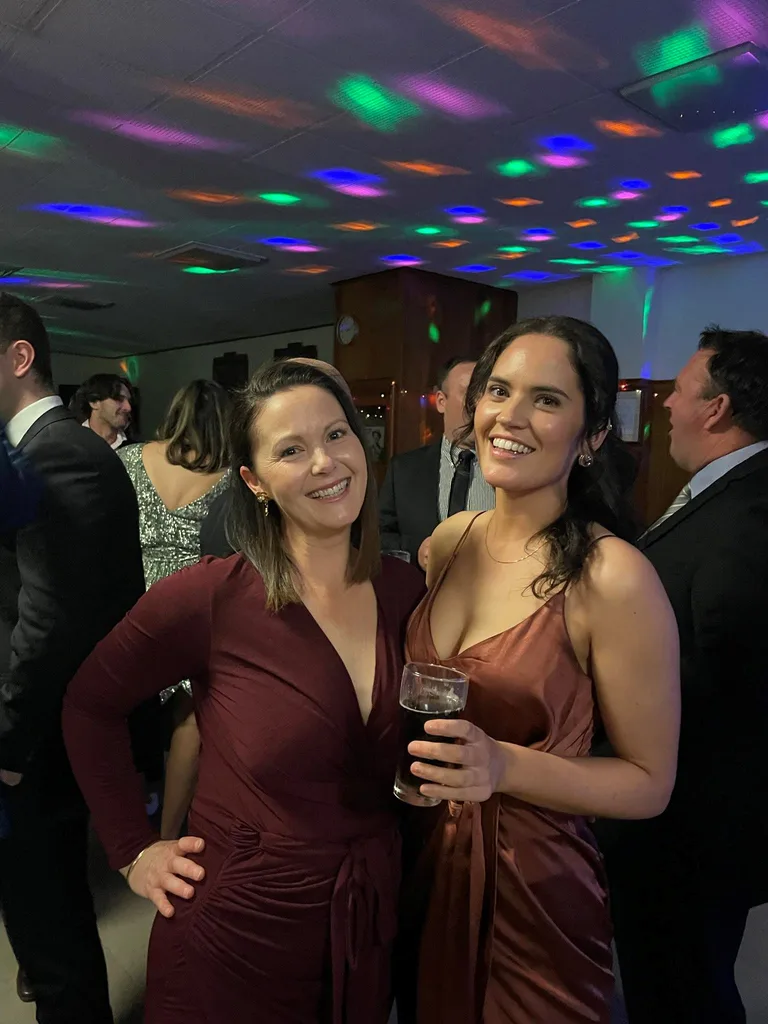 Zoe and her friend Abby all dressed up at the netball and football ball