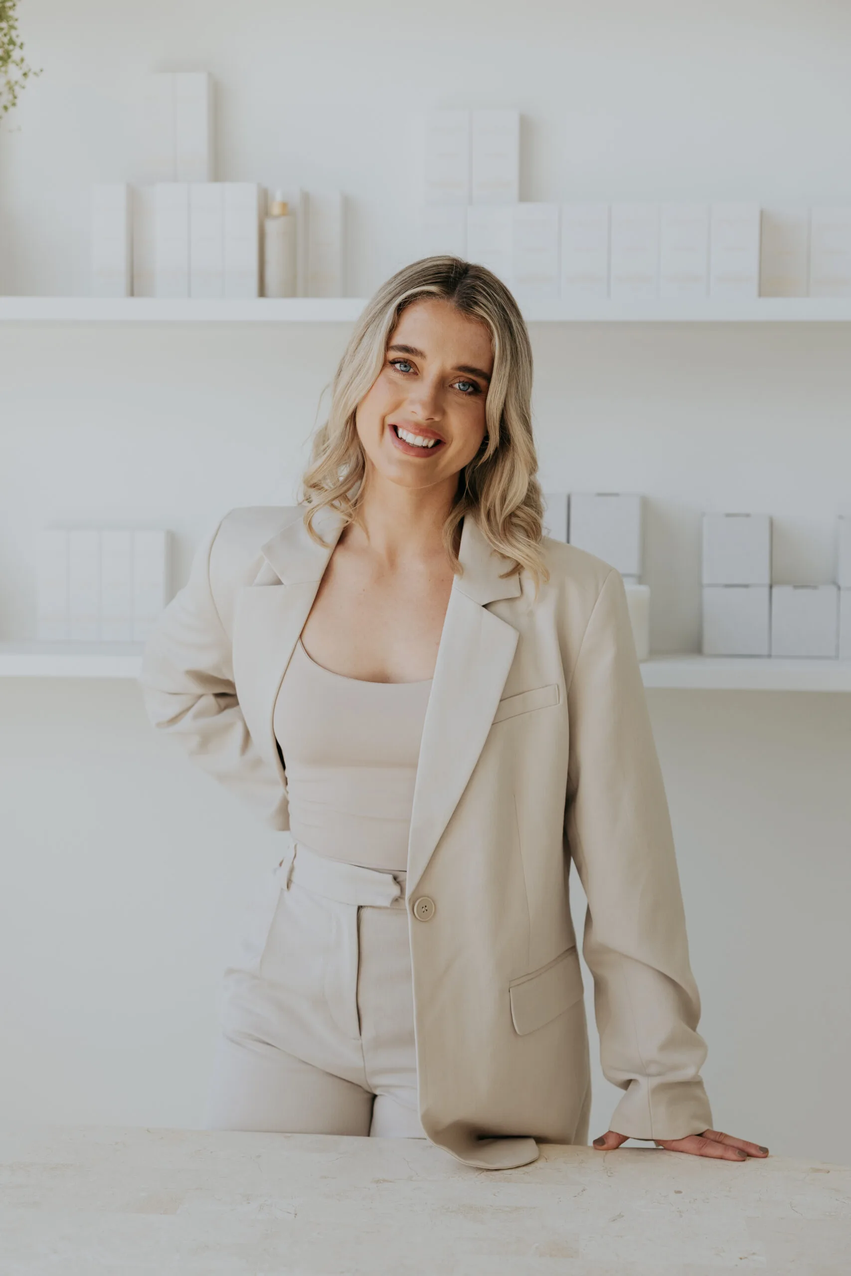 Bethany Mantle standing in an all-white room