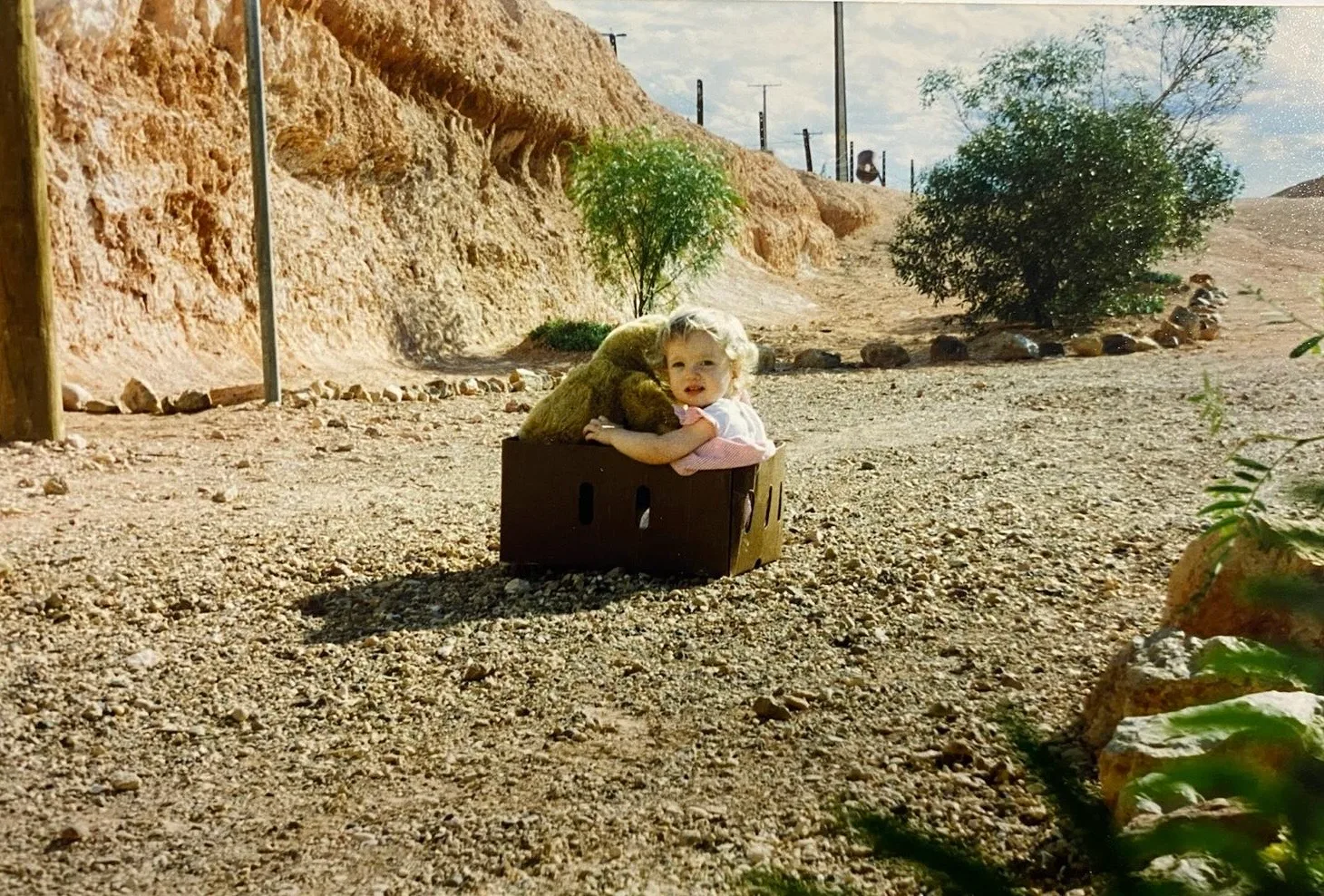 Bethany as a baby in a cardboard box
